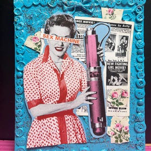 May include: Mixed media artwork featuring a vintage image of a woman with the text "SEX MACHINE" overlaid. The artwork includes a pink vibrator, vintage advertisements, and a blue button-framed border.