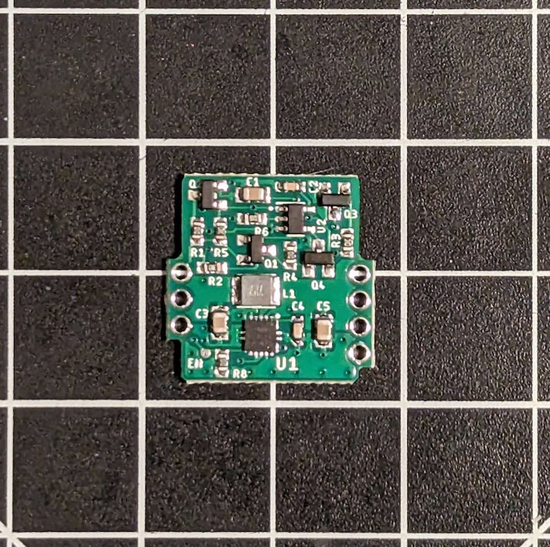 May include: A green circuit board with various electronic components, including resistors, capacitors, and an integrated circuit labeled "U1".