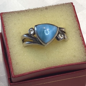 925 silver. Elegant ring with very beautiful triangular larimar stone and two small colorless stones. Size 9 3/4 US.