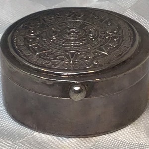 925 silver. Very pretty little box for rings or other small items with an Aztec calendar on the lid.