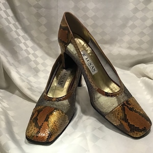 Luxas. Magnificent shoes from Spain in black and gold mesh and python leather, 2 1/2 inch heels. Size 39.