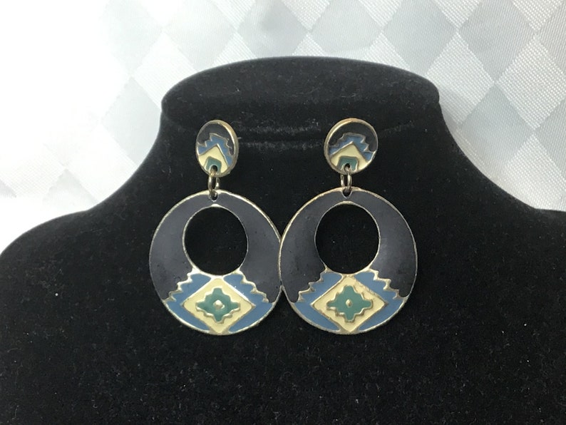 green Pretty gold earrings with ethnic cream blue and black designs with two sections.