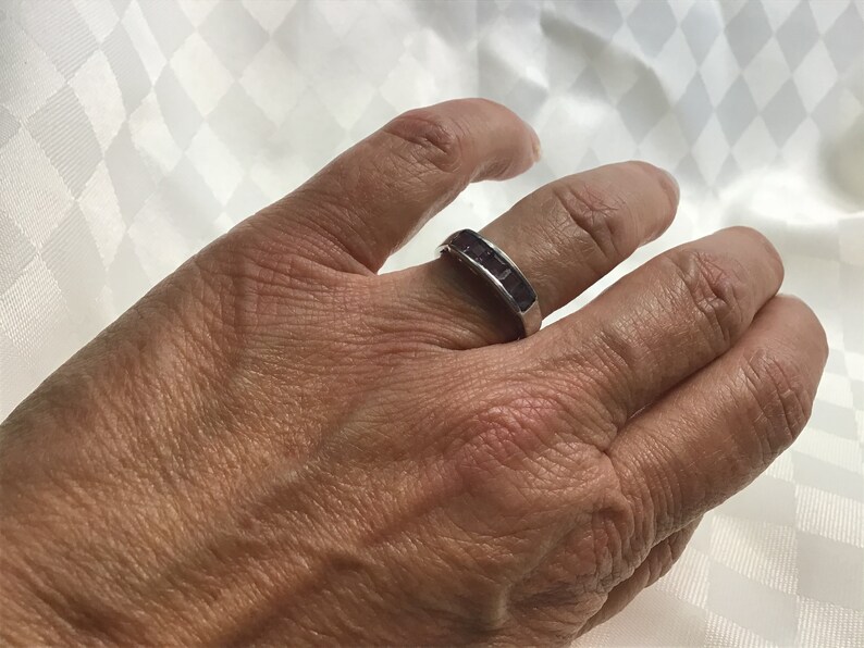 Pretty ring with five square amethyst stones work open on both sides. Silver 925
