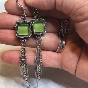 Beautiful earrings in tinplate and green glass on locking hooks.