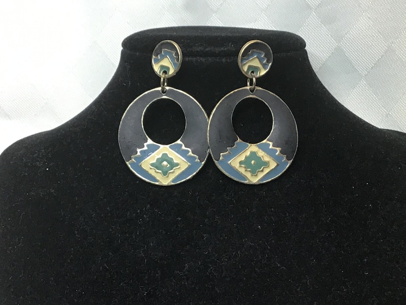 green Pretty gold earrings with ethnic cream blue and black designs with two sections.