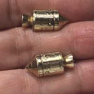 APOLLO 11. Fantastic ear clips depicting the service and command module of the 1969 rocket.