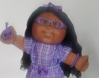 black cabbage patch doll with glasses