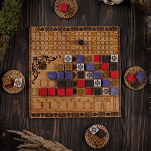May include: A wooden board game featuring a grid, floral patterns, and colourful wooden blocks. The game includes red, purple, black, and white blocks, plus matching coasters. The board is made of light-coloured wood, with the game pieces arranged on a dark wooden surface.