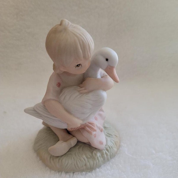 Lefton China Figurines Child with Goose and Boy Feeding Squirrels, Christopher Collection, sold as pair.