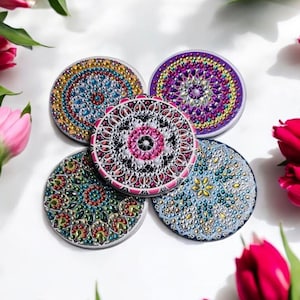 May include: Four round decorative coasters with colorful mandala designs. Each coaster features a different pattern of colorful rhinestones and beads.