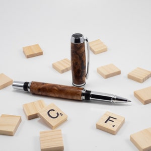 Baron Chrome ball pen in Eucalyptus Loupe encrusted with blue stone