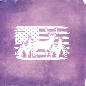 May include: White silhouette of a deer with antlers, trees, and an American flag design on a textured purple background. The flag features stars and stripes, with the deer and trees in the foreground.