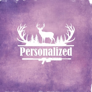 May include: White graphic on a purple background. The design features a deer silhouette with antlers, trees, and the word "Personalized". A rifle is at the bottom of the design.