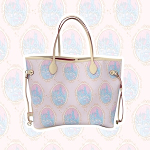May include: A light pink tote bag with a repeating pattern of oval frames containing a castle illustration in blue and pink. The bag has cream-colored handles and trim, with red accents inside.