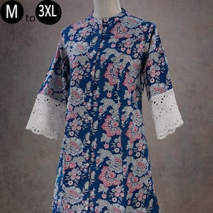 May include: A blue floral print cotton tunic with white lace trim on the sleeves and a white button-up front. The tunic is paired with white cotton pants with lace trim at the bottom. The text "M to 3XL" is visible in the top left corner of the image.