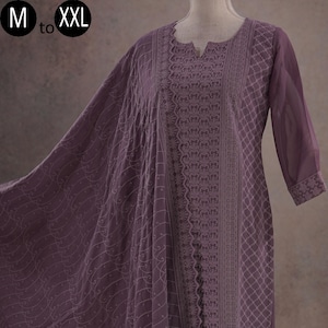 May include: A purple embroidered kurta set with a matching dupatta. The kurta has a V-neckline and three-quarter sleeves. The dupatta is sheer and has a floral pattern. The set is available in sizes M to XXL.