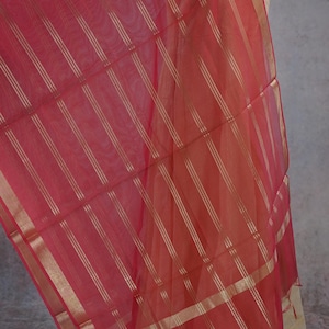 May include: A rustic wooden sign with the text "Welcome to our home" in white lettering. The sign has a distressed finish and a simple, inviting design, ideal for entryway decor.