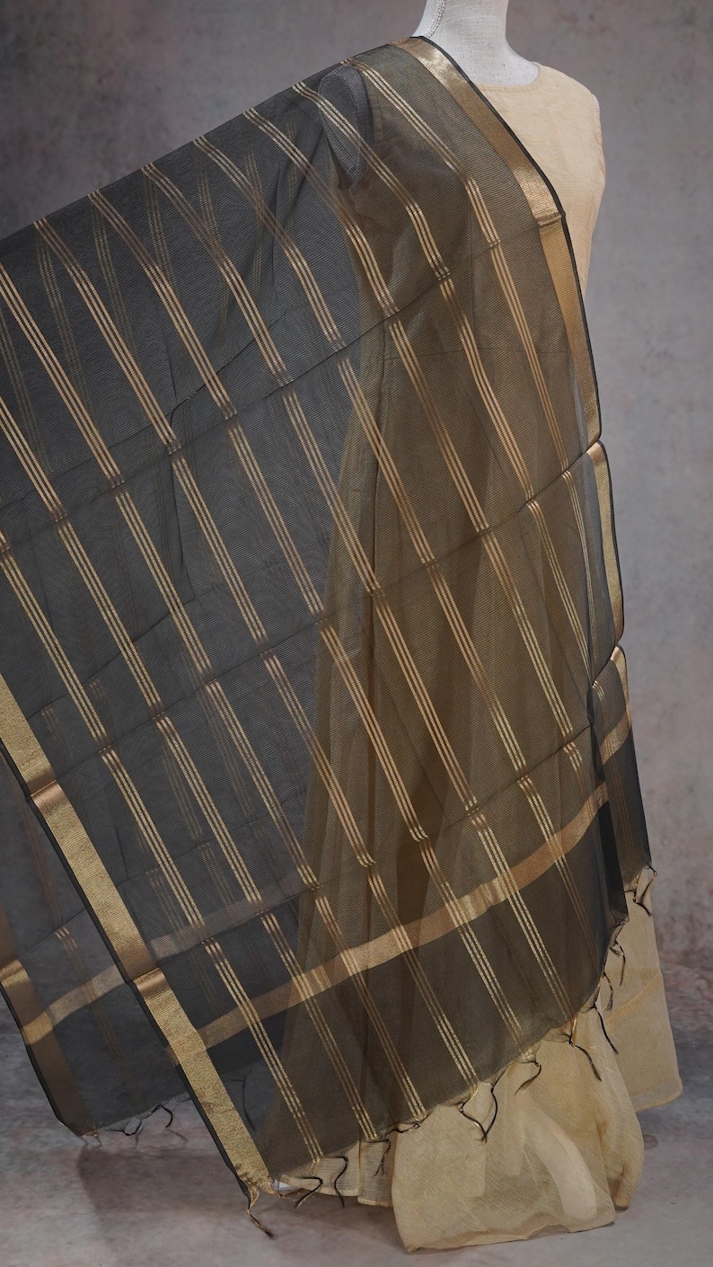 May include: A set of three ceramic mugs with a speckled, matte finish in cream, light grey, and dark grey. Each mug has a simple, minimalist design, ideal for tea or coffee.