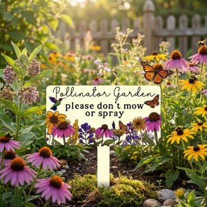 May include: A rectangular garden sign with the text "Pollinator Garden please don't mow or spray." The sign features illustrations of flowers, butterflies, and a hummingbird. The sign is set in a garden with various flowers.