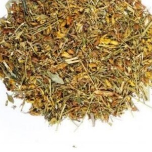 May include: A pile of dried herbs and flowers, with a mix of green, brown, and yellow hues. The texture appears to be coarse and natural, suggesting a product for culinary or medicinal use. The image is set against a plain white background.