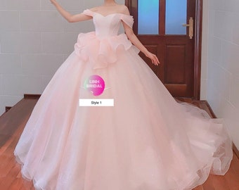 Light/nude pink off the shoulder tulle ball gown wedding dress with train and ruffles/feather details - various styles