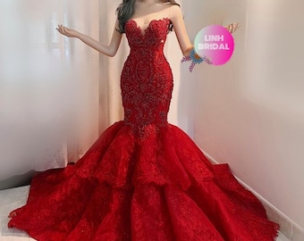 Dramatic red beaded fit and flare wedding/evening gown with tiered lace skirt and chapel train