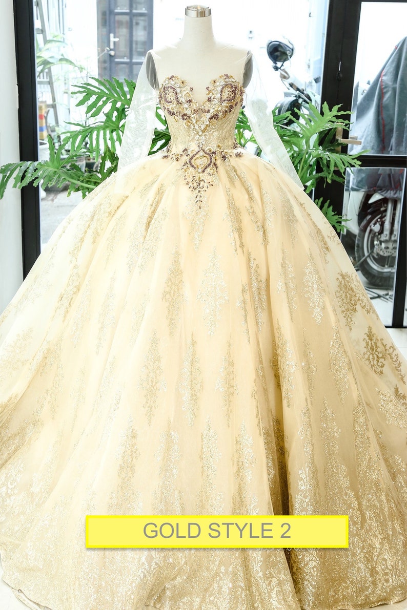 gold ball gown with sleeves
