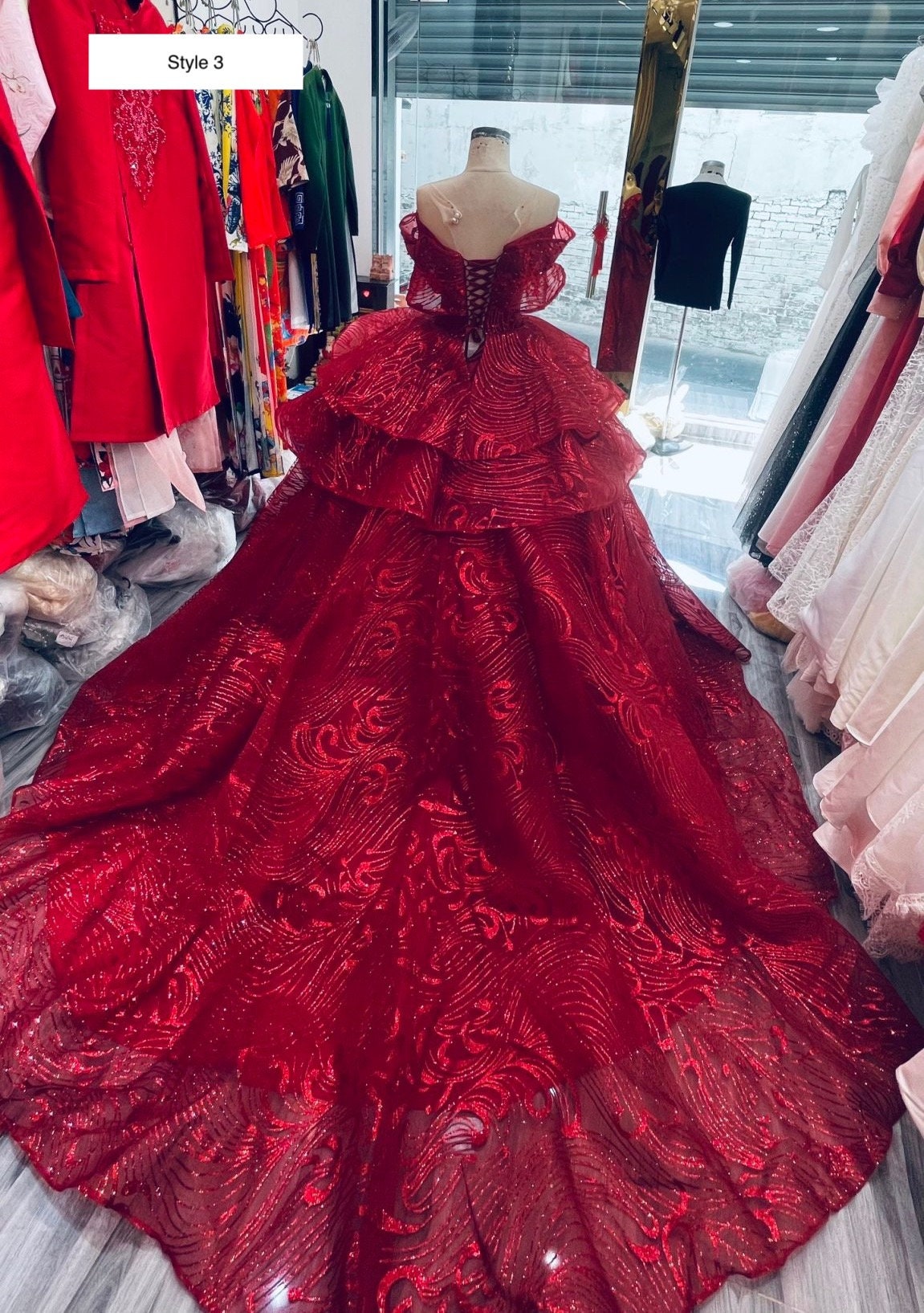 Premium Photo | A red wedding dress with a long train and a long train