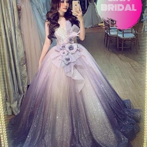 Dramatic purple sparkly ballgown wedding dress with big flower detail and matching veil