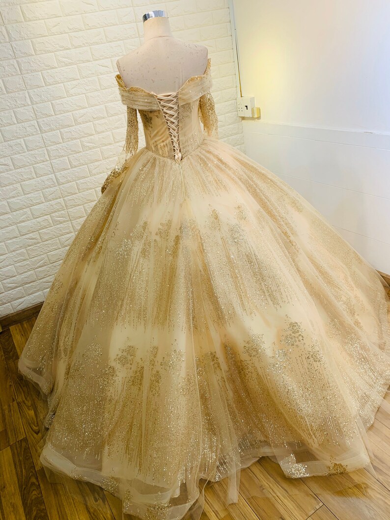 gold ball gown with sleeves