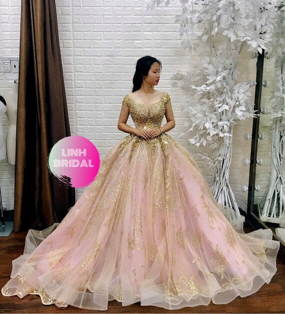 pink and gold ball gown