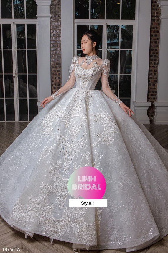 Women's beautiful full sleeve floor length tulle skirt wedding gown in white