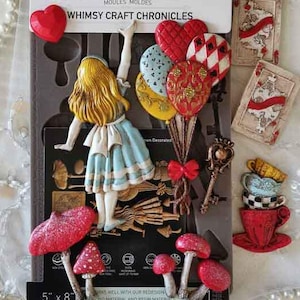 May include: A silicone decor mould package titled Whimsy Craft Chronicles featuring a girl with blonde hair in a blue dress, heart-shaped balloons, mushrooms, and playing card designs. The packaging indicates a 5 inch by 8 inch size for the mould.