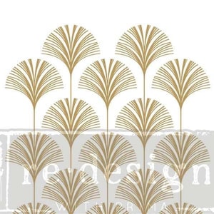 May include: A stencil with a repeating pattern of gold fan-shaped designs. The stencil is labeled "Redesign with Prima" and has a registered trademark symbol.