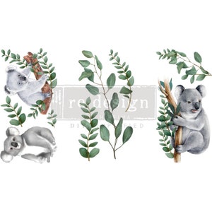 May include: Three watercolor illustrations of koalas on branches with eucalyptus leaves. The koalas are gray and have black noses and eyes. The leaves are green and have a watercolor effect.