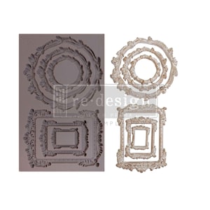 May include: A collection of decorative frame molds in various sizes and shapes. The molds include circular and rectangular frames with ornate, vintage-style detailing. The frames are in shades of gray and off-white, with the text "re-design with prima" visible.