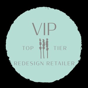 May include: A light blue circle with a white VIP logo and the text "TOP TIER REDESIGN RETAILER". The logo is surrounded by three gray lavender stalks.