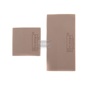 May include: Two taupe-colored, rectangular and square-shaped DIY stencils. The stencils have the text "re-design with Prima DIY Simplified" printed on them. The stencils are on a white background.