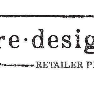 May include: Black and white logo for "re design RETAILER PLUS". The logo is in a rectangular frame with a lavender sprig on the left. The text is in a distressed font, giving it a vintage or handmade feel.