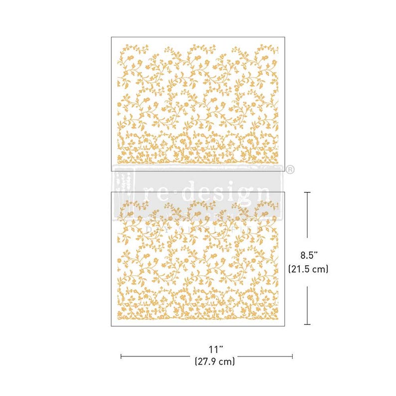May include: Two rectangular stencils with a floral vine design. The stencils are 11 inches (27.9 cm) wide and 8.5 inches (21.5 cm) tall. The floral pattern is in a gold color, and the background is white. The stencils are labeled with the text "re design".