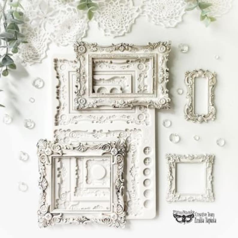 May include: White silicone mold with multiple ornate frame designs. The mold is for creating decorative resin or polymer clay frames.