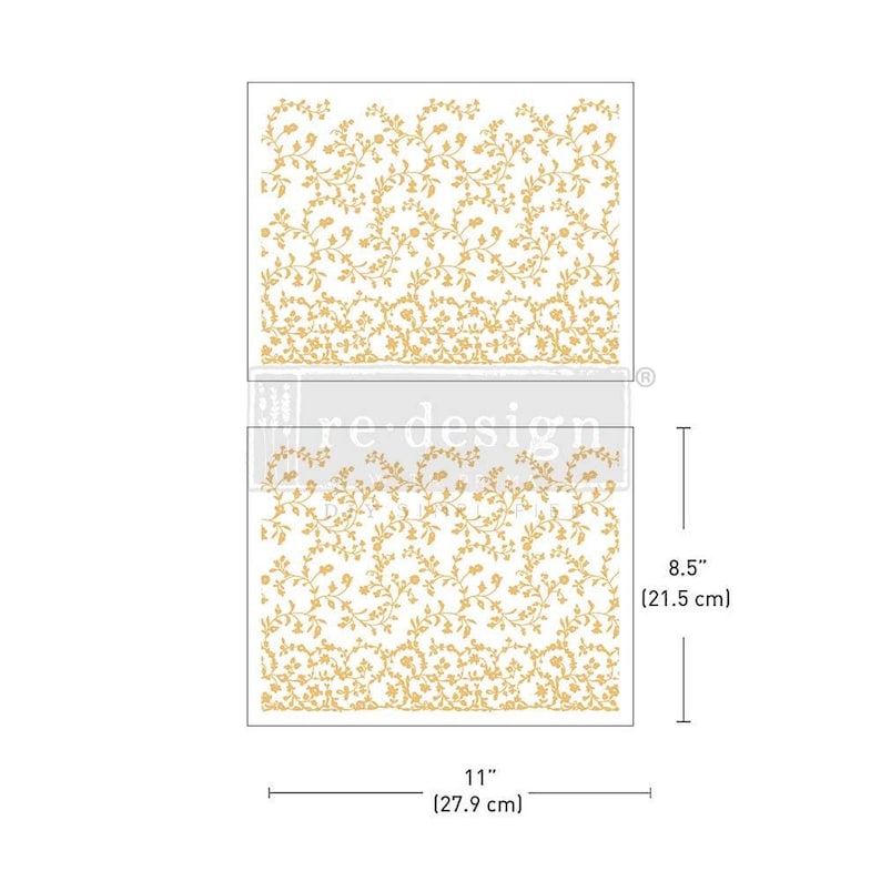 May include: Two floral design transfers. The transfers are 11 inches (27.9 cm) wide and 8.5 inches (21.5 cm) tall. The design features a repeating pattern of gold-colored flowers and vines on a white background. The transfers are for re-design.