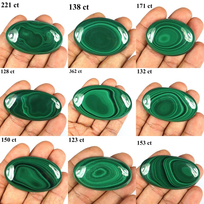 May include: Nine oval-shaped malachite gemstones with varying patterns and shades of green. Each stone is held in a hand and labeled with a carat weight, ranging from 123 ct to 362 ct. The polished stones display unique swirling designs.