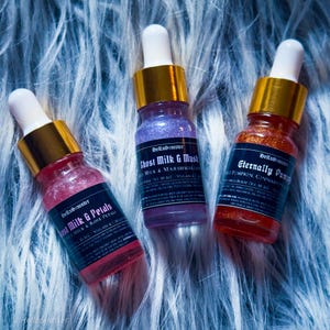 Shimmery body oil samples in autumnal and floral scents – indie perfume oils by HellaSinister in 10ml dropper bottles