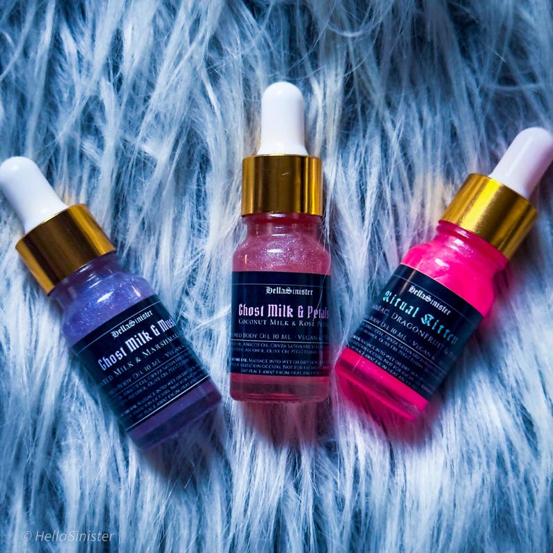 Indie body oil samples Ghost Milk & Petals and Ritual Kitten – pink and purple shimmer oils in 10ml glass dropper bottles