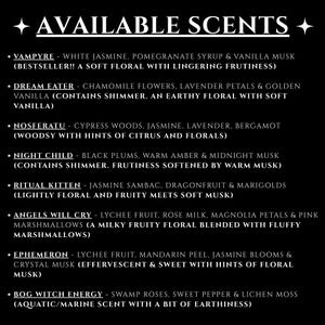 May include: A black background with white text listing available scents. Each scent is described with its ingredients, such as "Vampyre" with white jasmine and pomegranate syrup. The list includes "Dream Eater" and "Night Child".