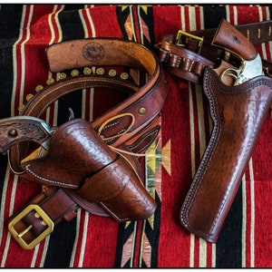 A Special Pair of One-Off Handmade Natural Leather, Right Hand Draw, Western Holsters. &quot;Hand of God&quot; & the &quot;Drifter&quot;. Colt SAA, Schofield