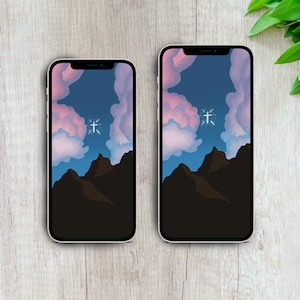 Pode incluir: Duas telas de iPhone idênticas exibindo uma ilustração digital de uma cordilheira com uma cruz branca no céu. O céu é um degradê de azul, rosa e roxo.
