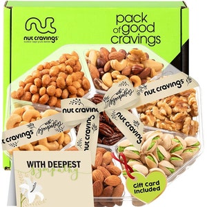 May include: A clear plastic tray filled with six different types of nuts, including cashews, almonds, pecans, pistachios, walnuts, and peanuts. The tray is tied with a brown ribbon with the words "with sympathy" and "nut cravings" printed on it. A card with the words "with deepest sympathy" is included.