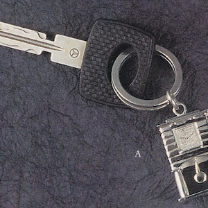 Mantel Pendulum Clock Silver Keychain Keyring by Michael Graves Design & Architecture